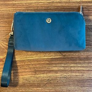 Lululemon wristlet/clutch. New without tags NWOT. Dark green